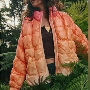 New Free People Movement peach and cream ombré puffer jacket.